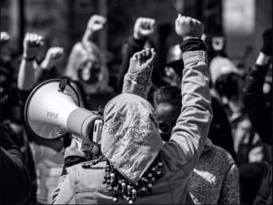 Protestors for civil rights with their fists in the air
