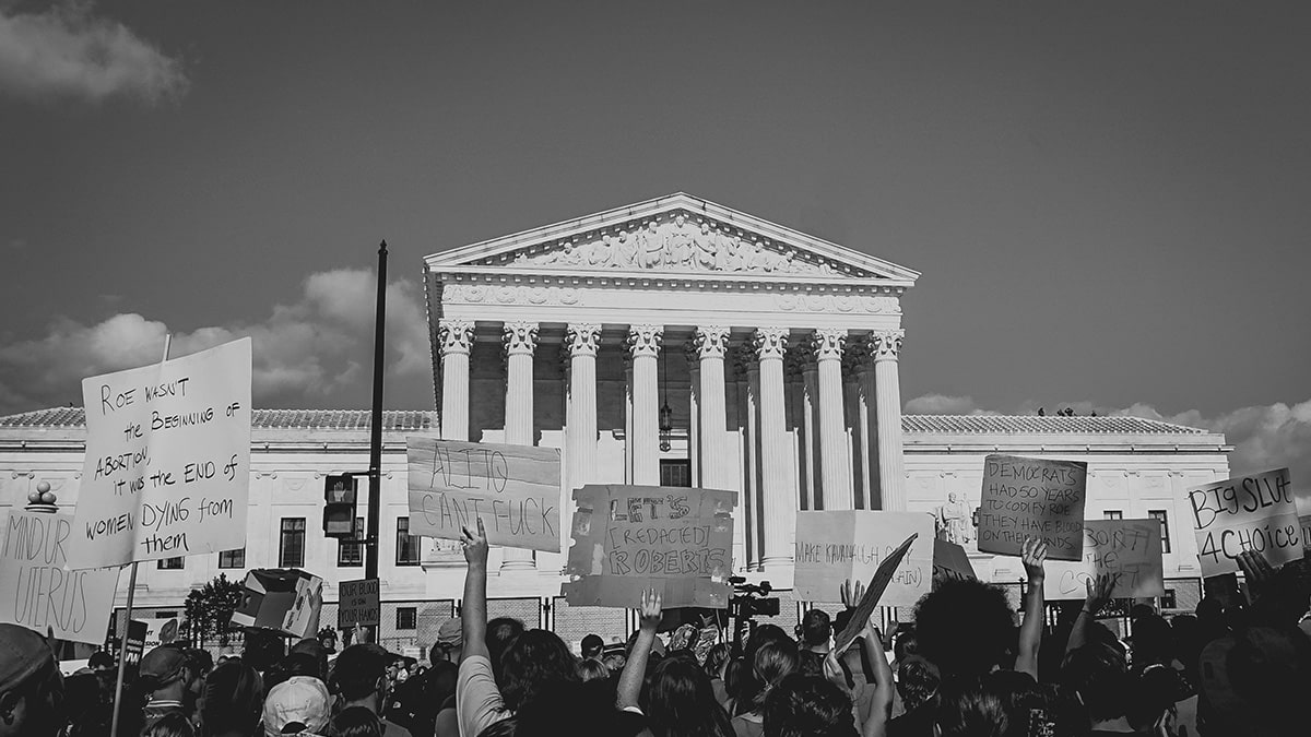 Hero image showing people protesting systemic racism in healthcare